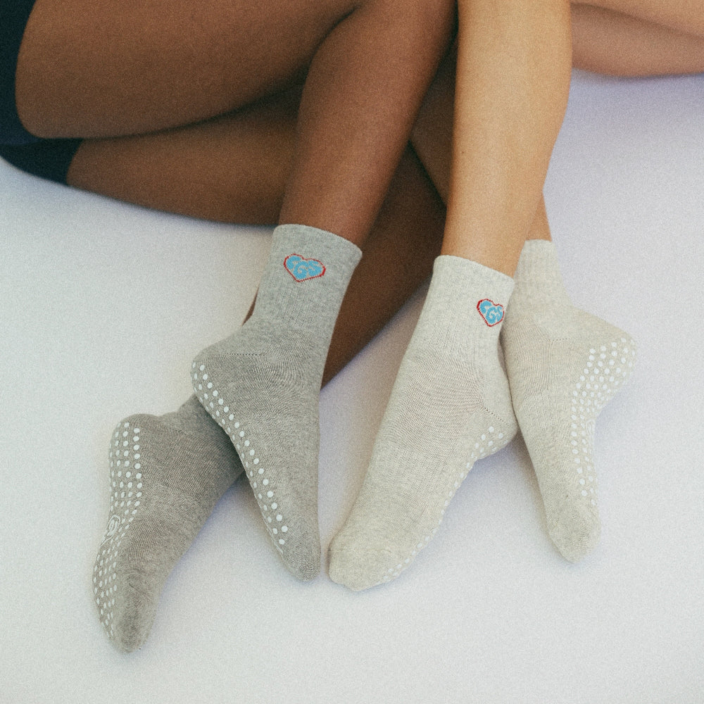 Women wearing grey midi crew grip socks